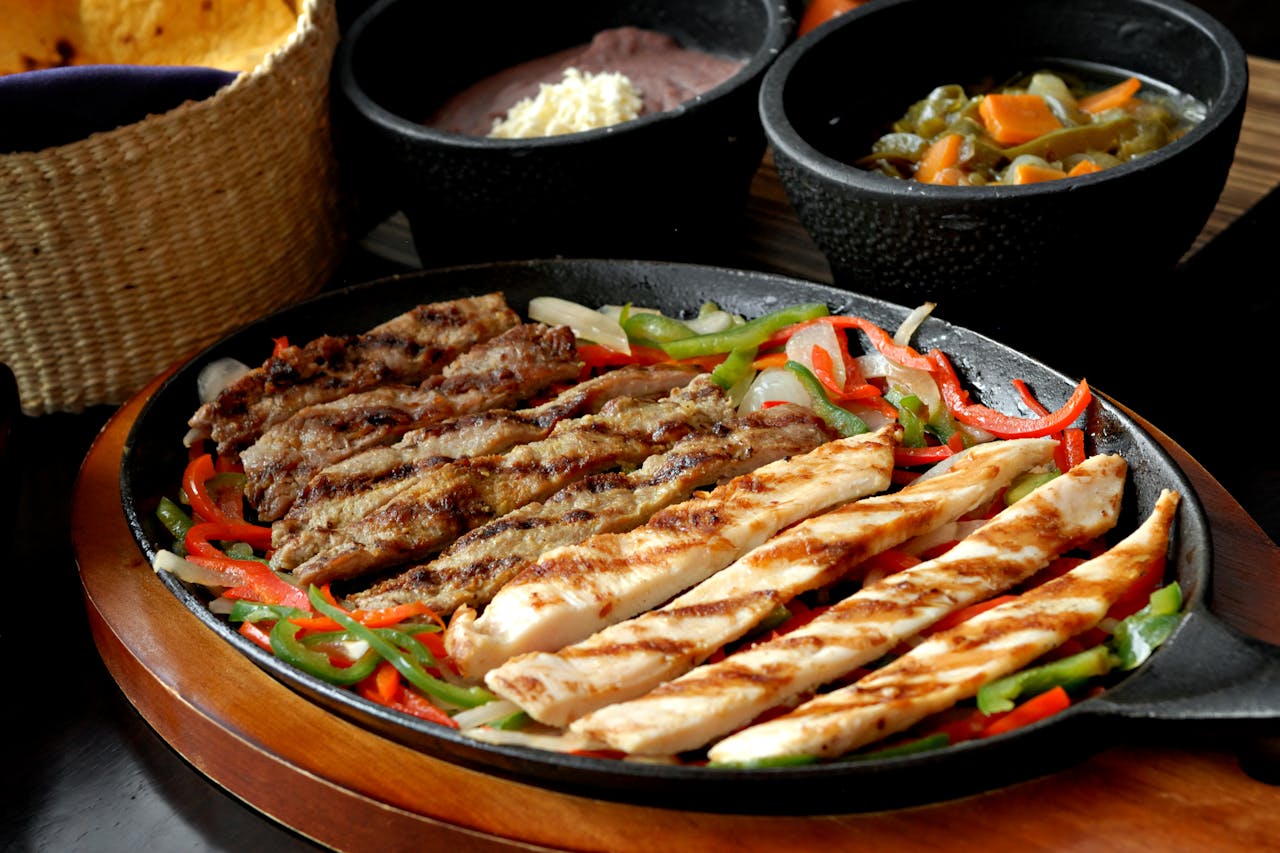 Authentic Mexican Chicken and Steak Fajitas Grilled with Sides