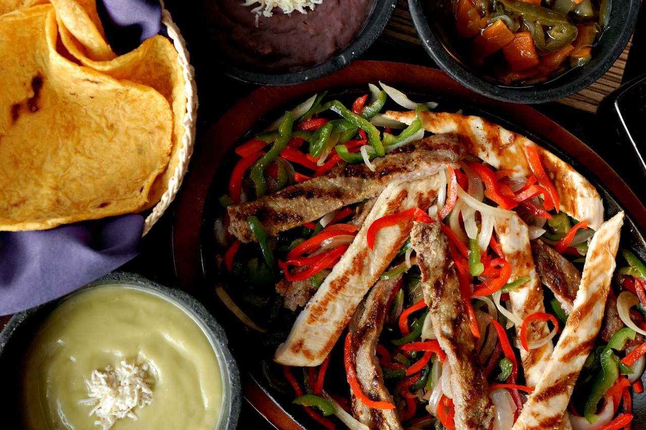 Authentic Mexican Chicken and Steak Fajitas Grilled with Sides